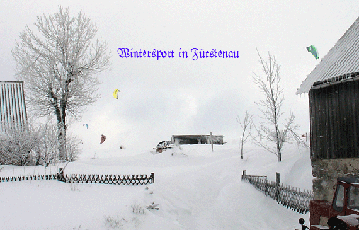 mit Snowboard und Gleitschirm